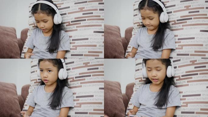 小女孩使用白色无线耳机