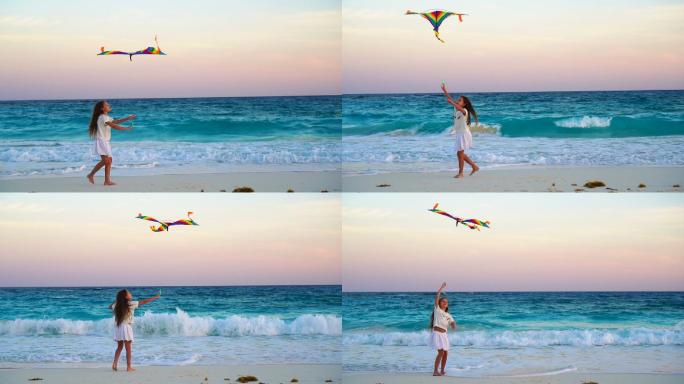 可爱的小女孩在热带海滩上放风筝