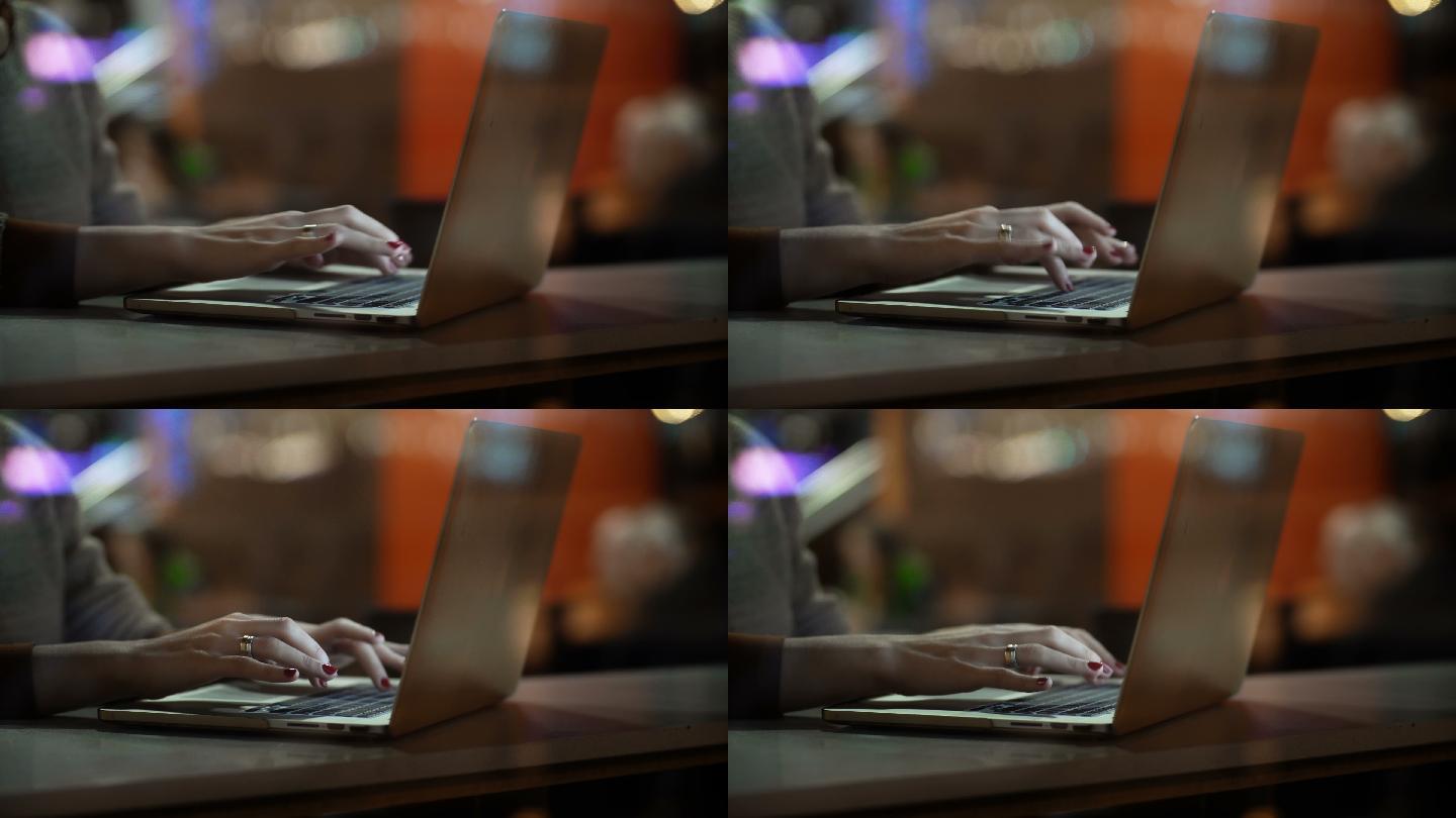 女性在笔记本电脑上打字的特写