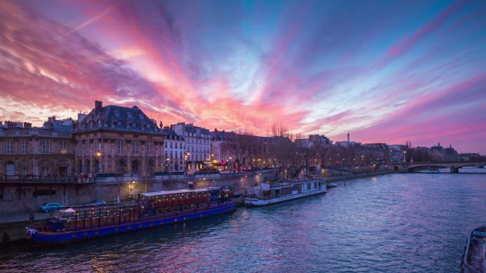 日落巴黎塞纳河大桥的河畔全景