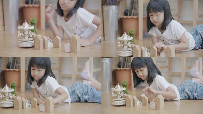 小女孩在客厅玩积木