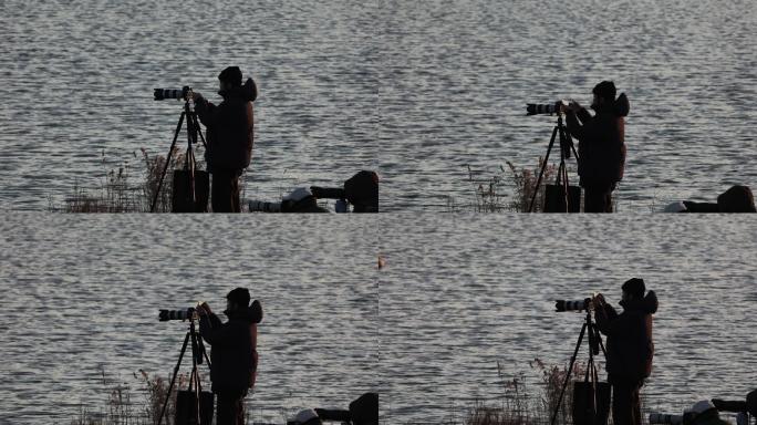 河边拍鸟的摄影师