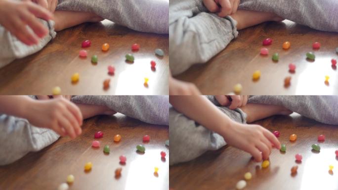 孩子数数，玩着五颜六色的糖果