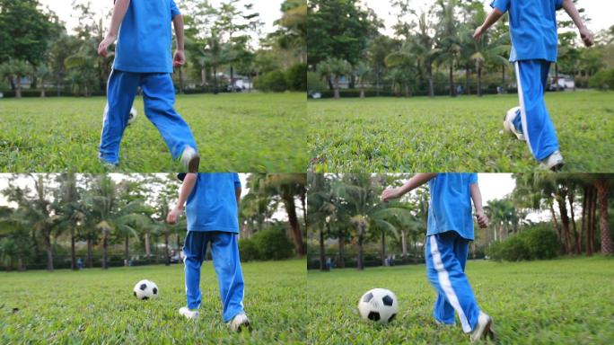 踢足球的男孩小孩草地草坪