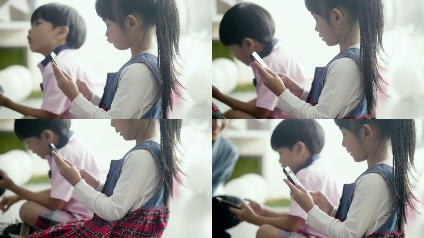 玩手机的小女孩小孩沉迷视频素材手机
