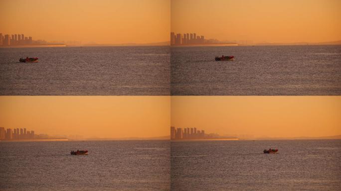 日出海面上的一只渔船