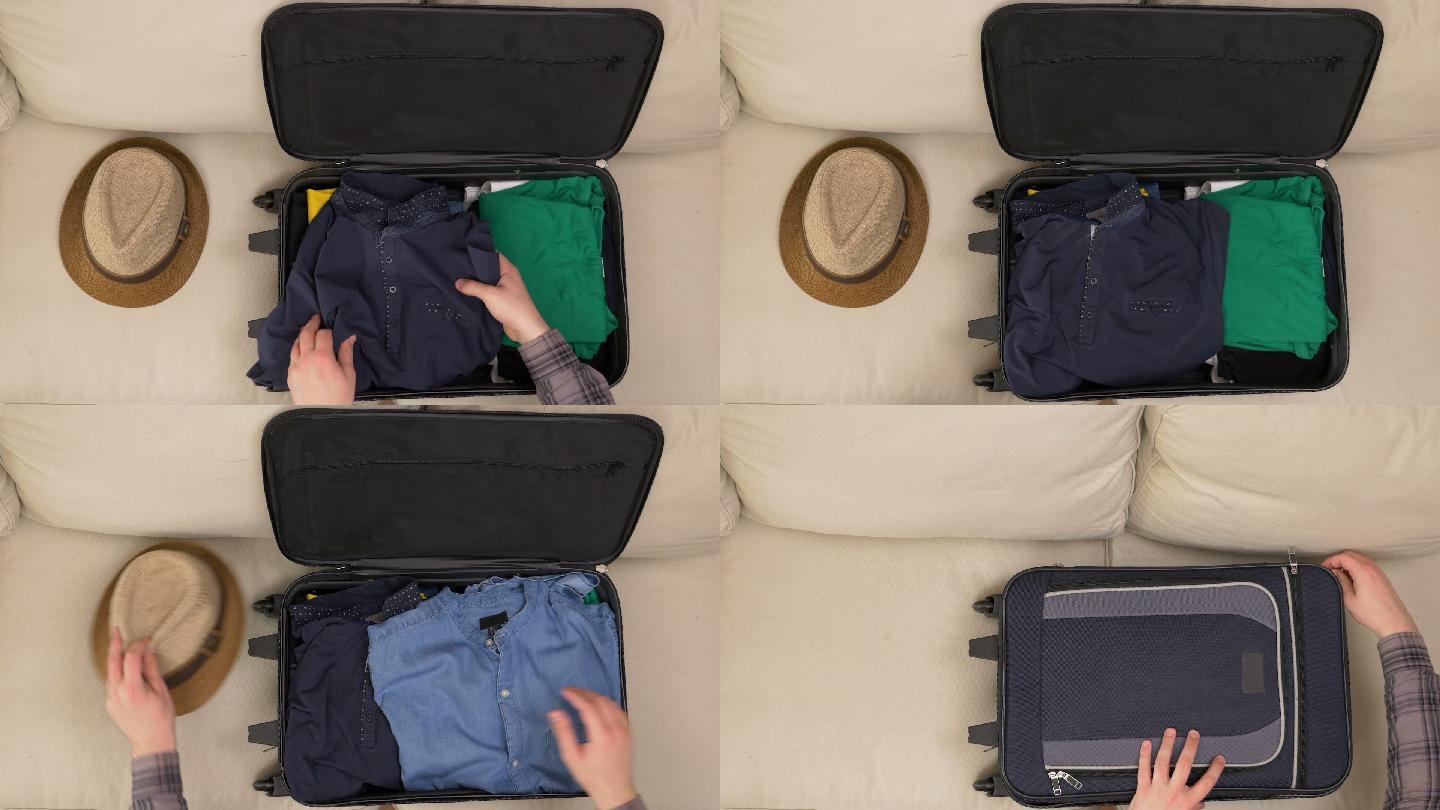 一名男子将衣服装进旅行袋