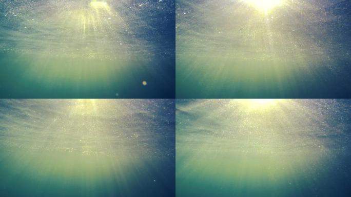 阳光弥漫在水面上光照射水层金光折射粒子光