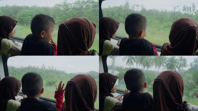 马来西亚地铁上的看窗外孩子