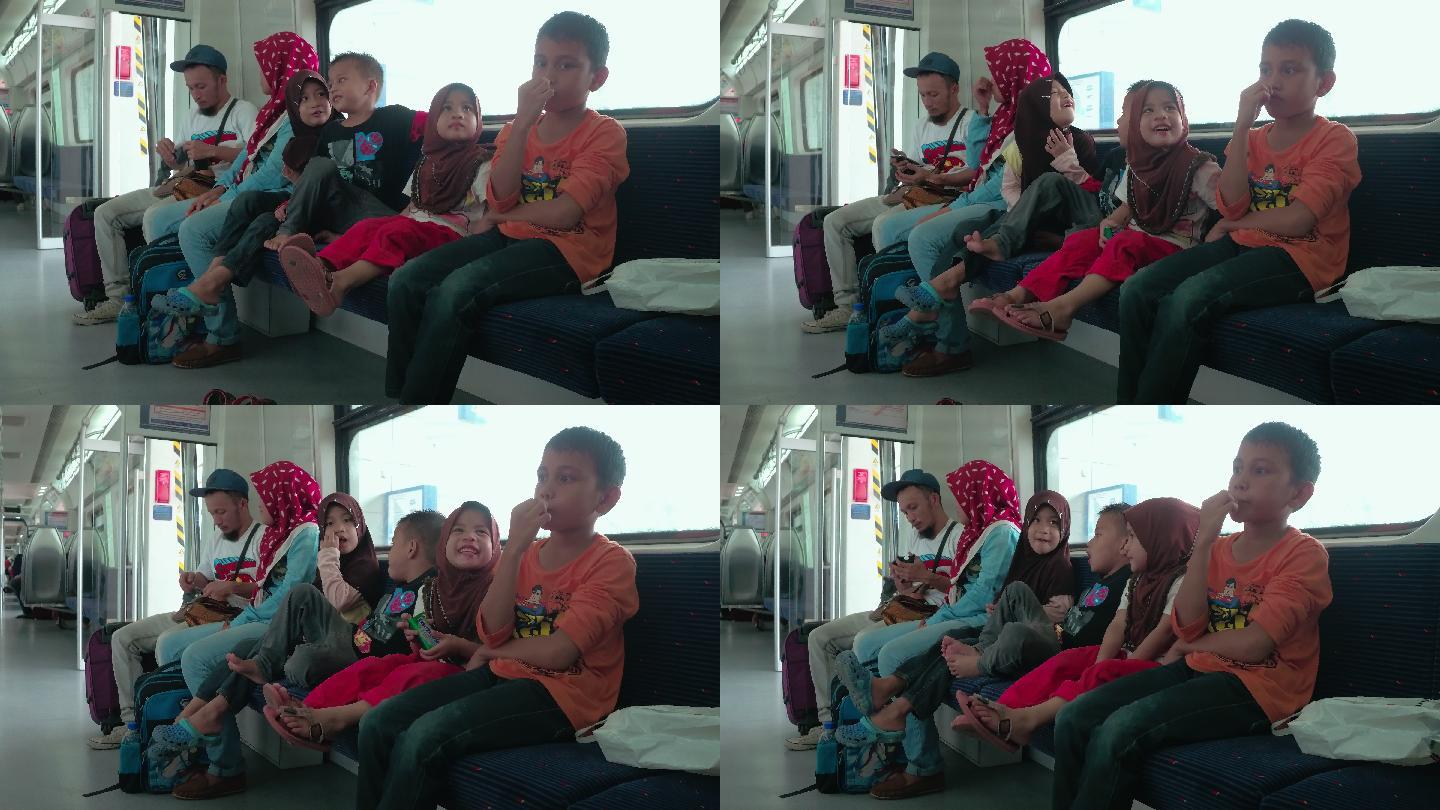 马来西亚地铁上的父母和孩子