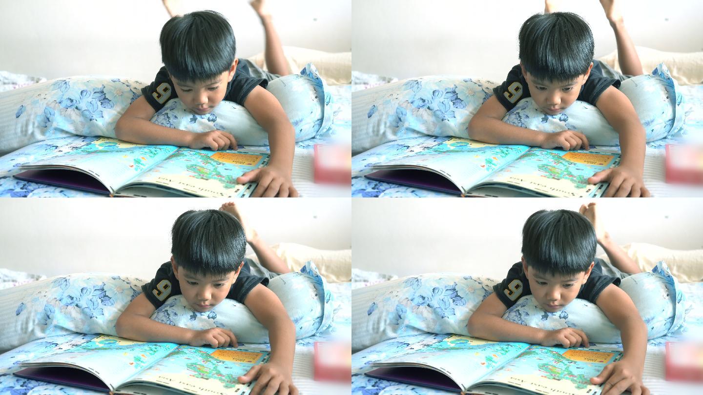 男孩在卧室看书眼睛视力躺着看书儿童看书