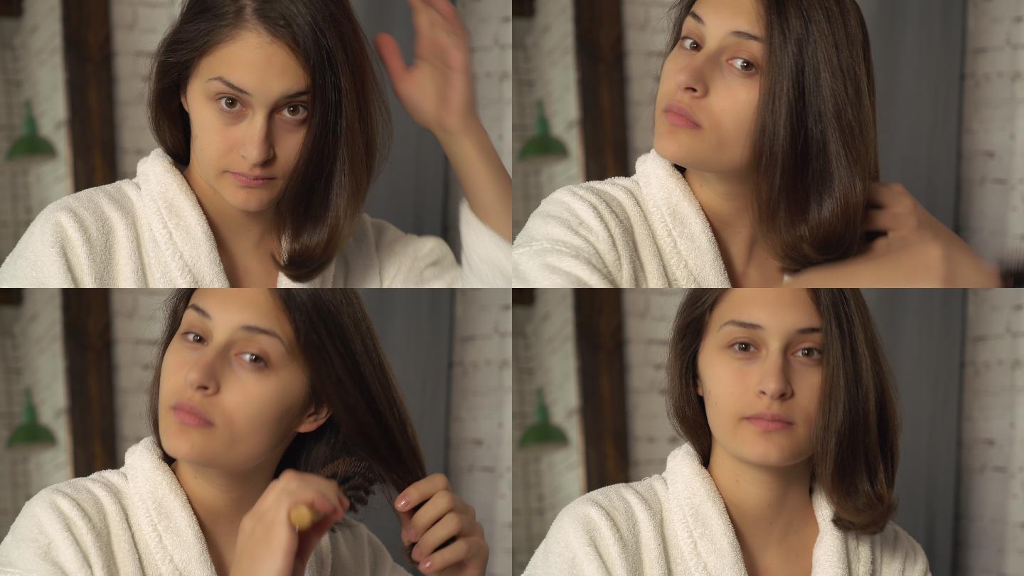 年轻女子梳她的头发