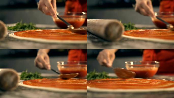 在披萨上抹番茄酱烹饪料理制作美食美味饭店