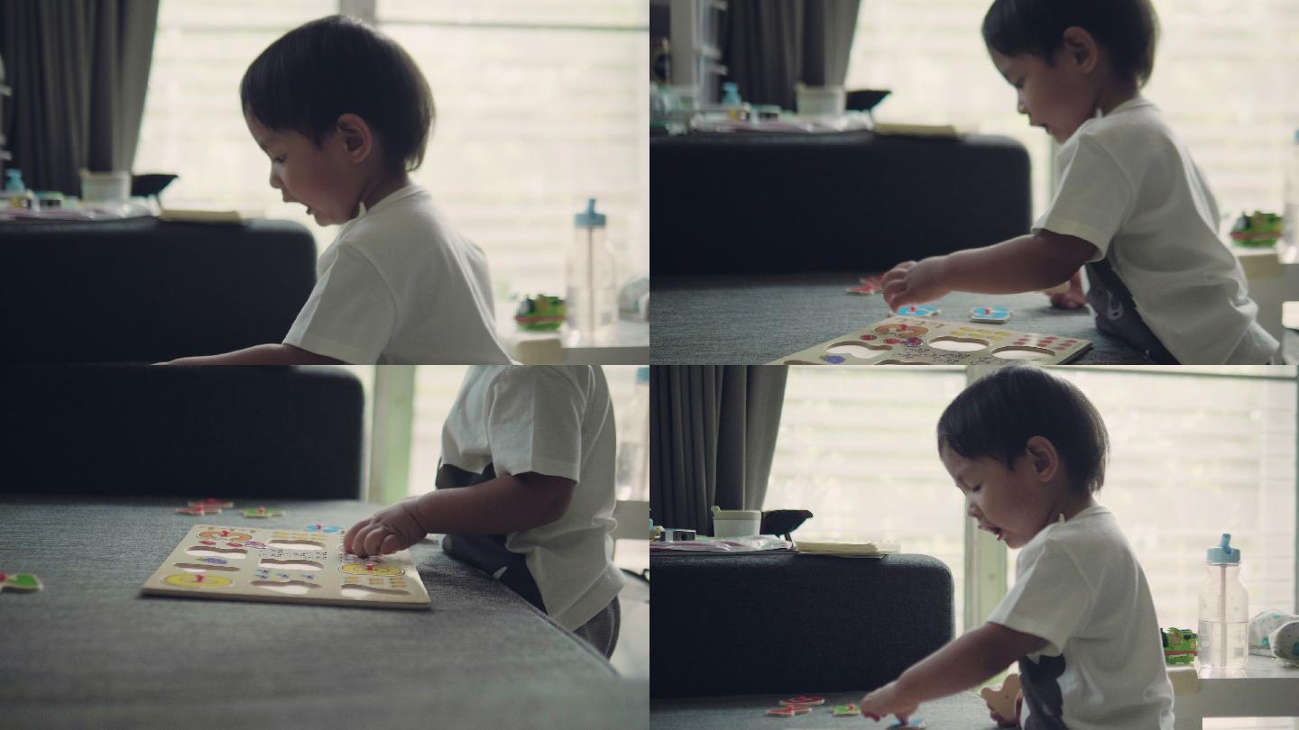 可爱的小男孩在客厅玩游戏