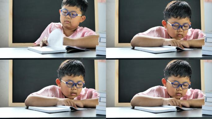 可爱的亚洲小男孩渴求知识的孩子戴眼镜的小