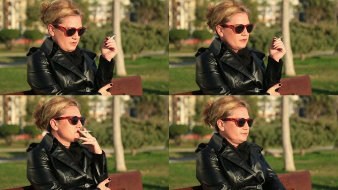 坐在公园长椅上抽烟的女人