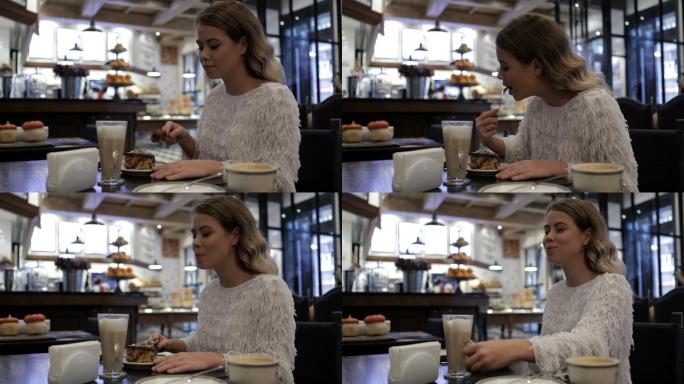 女孩在咖啡馆吃美味糕点和咖啡