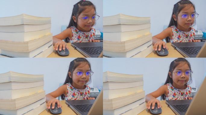 小女孩玩笔记本电脑的视频