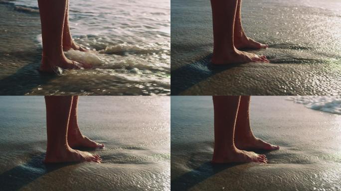 光着脚站在海滩上海水海浪浪花