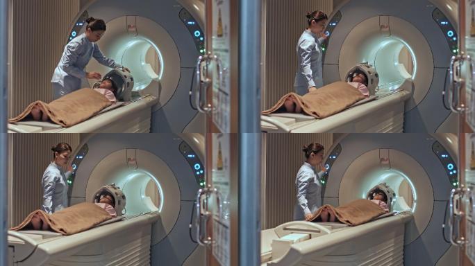 护士在医院为一位年轻的女孩做核磁共振