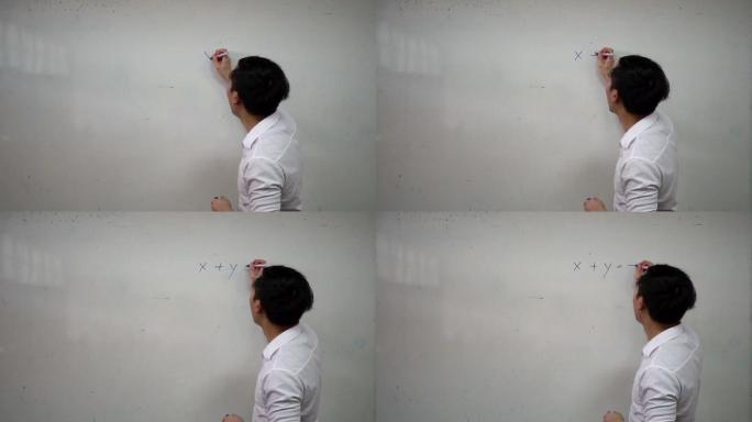 年轻英俊的数学老师正在白板上写字