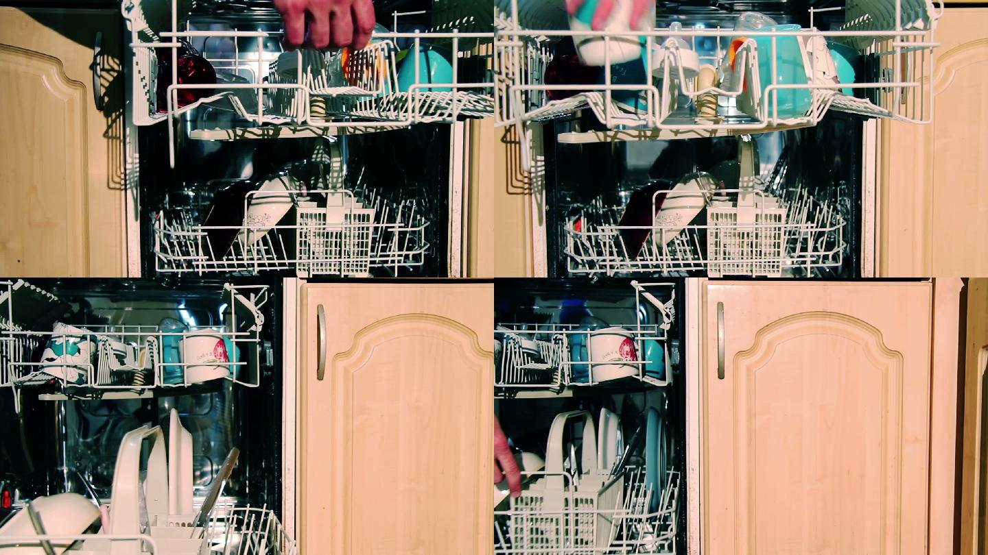 一个人装洗碗机准备使用。