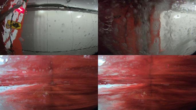 在城市的洗车站，水滴在汽车的挡风玻璃上