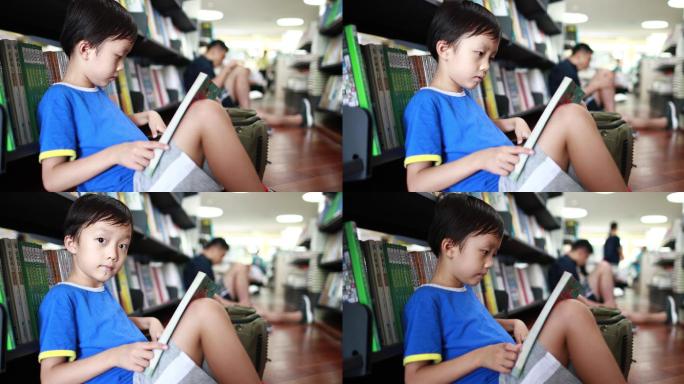 孩子在图书馆看书阅读培养书籍书架