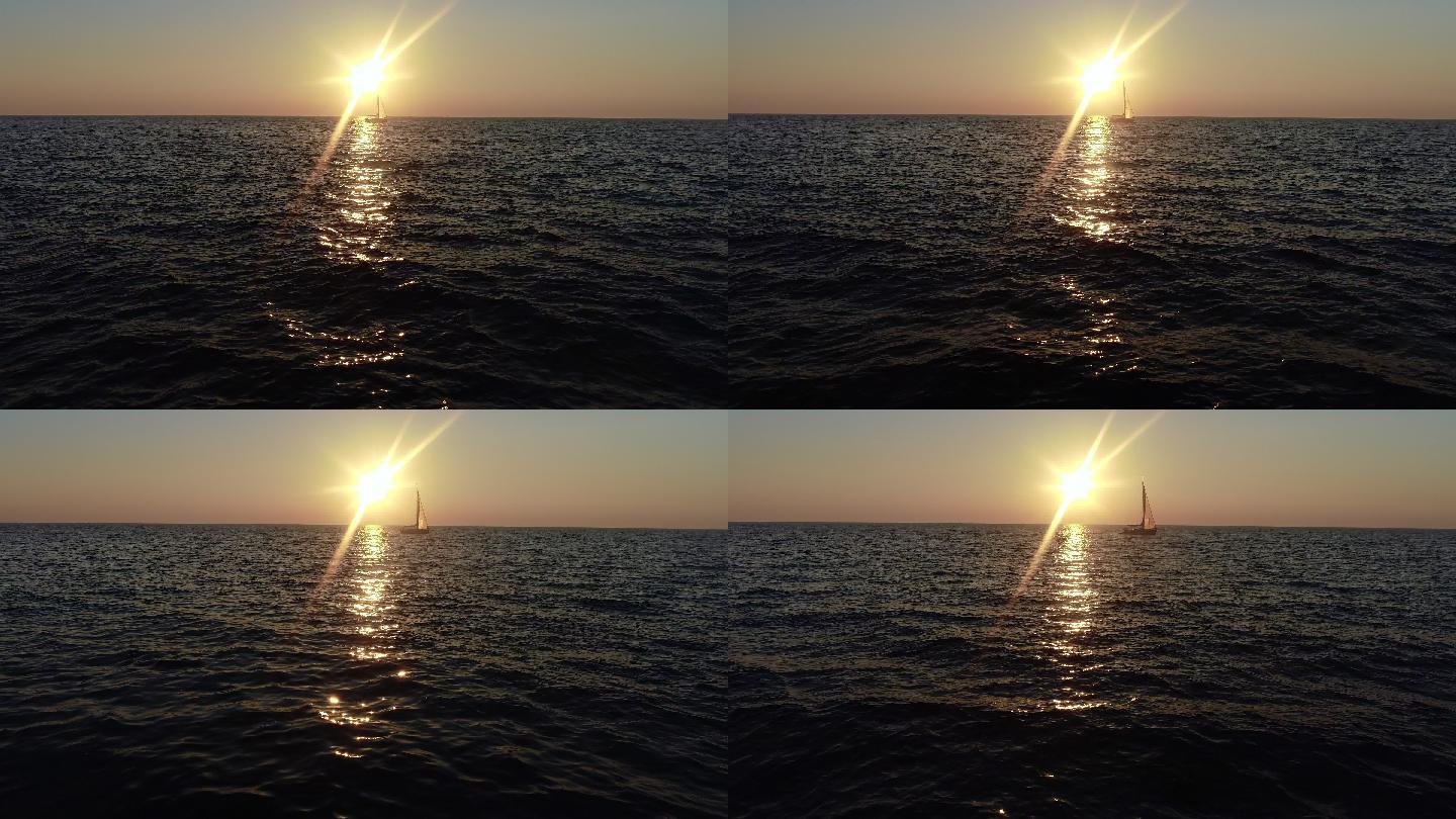 地平线上的日落帆船。