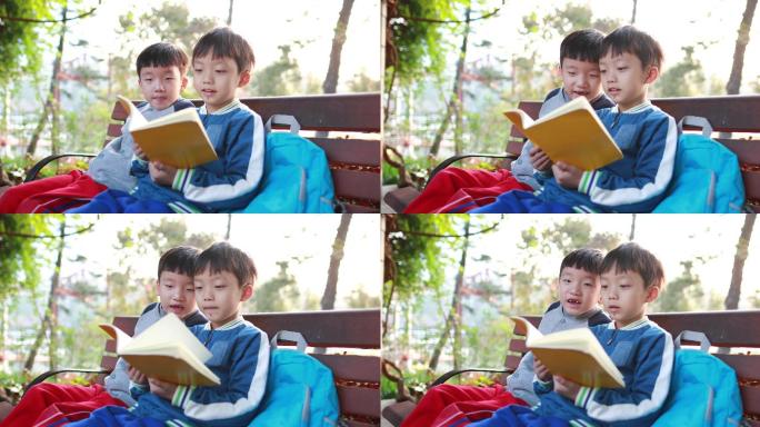 小男孩在公园看书学习