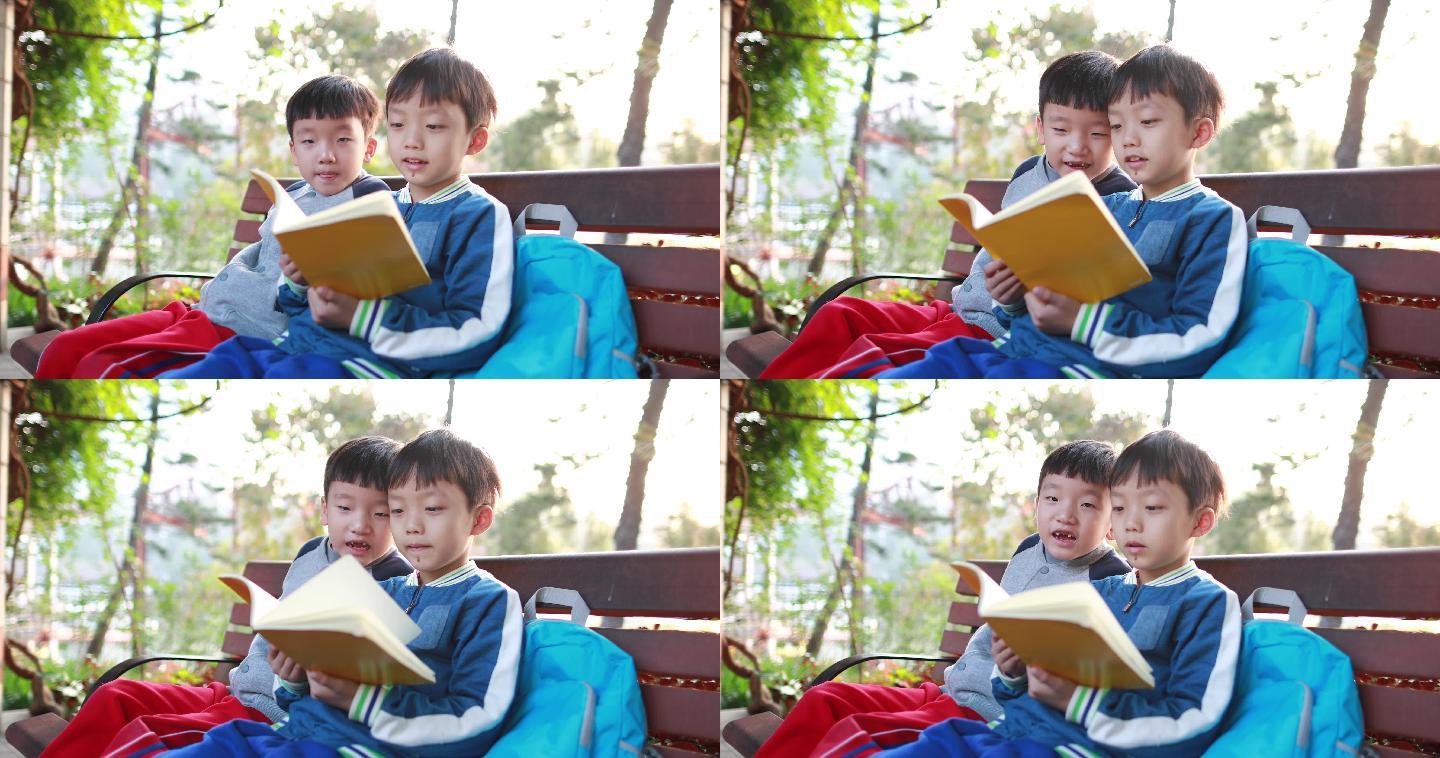 小男孩在公园看书学习