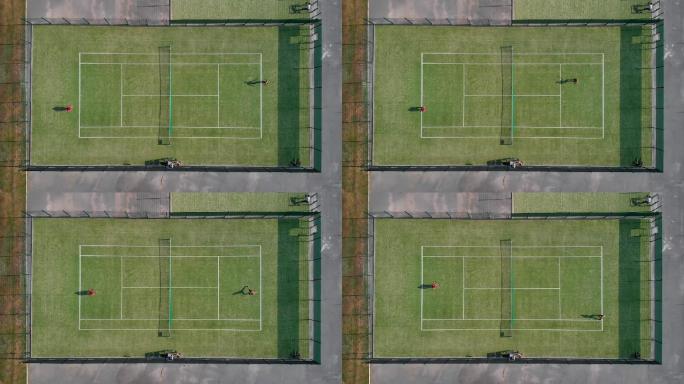 无人机在人们打球的网球场上空拍摄