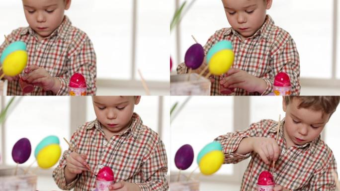 快乐的孩子在画复活节彩蛋