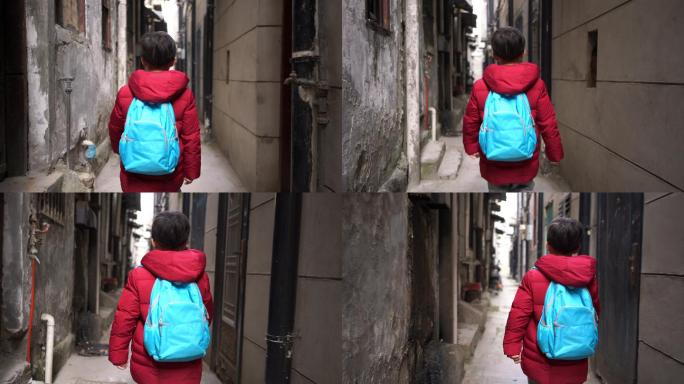 男孩在巷子里走路小巷放学视频素材背书包回
