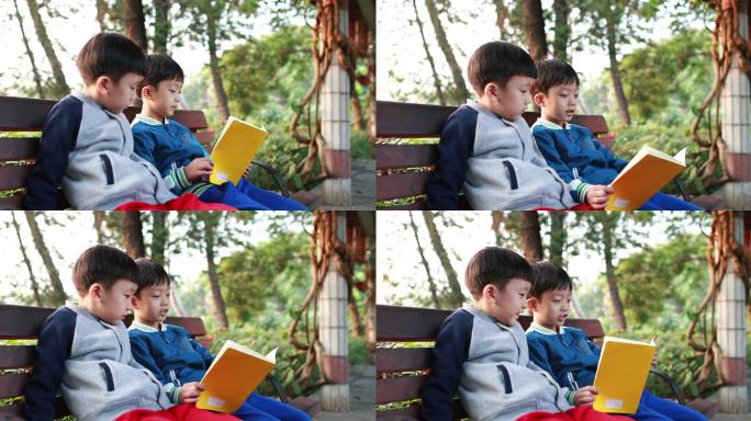 在公园看书的小男孩