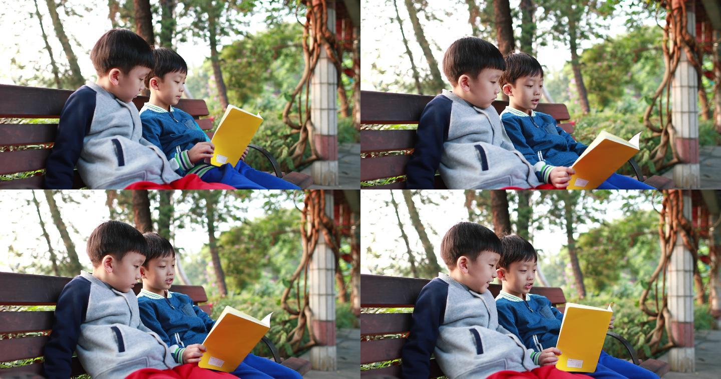 在公园看书的小男孩