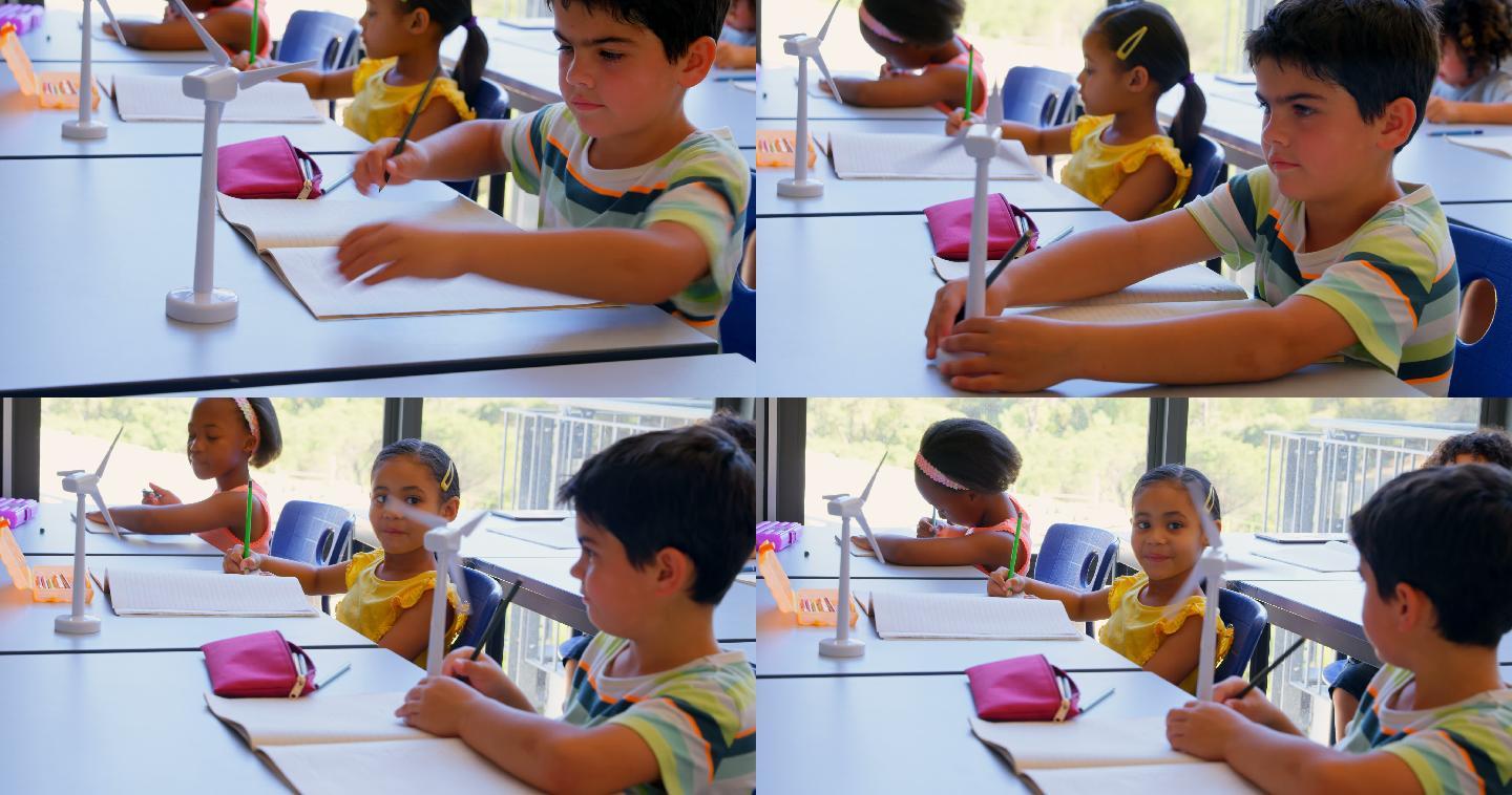 在学校的教室里，孩子在课桌上学习。