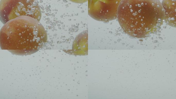 桃子掉落在水中的慢镜头