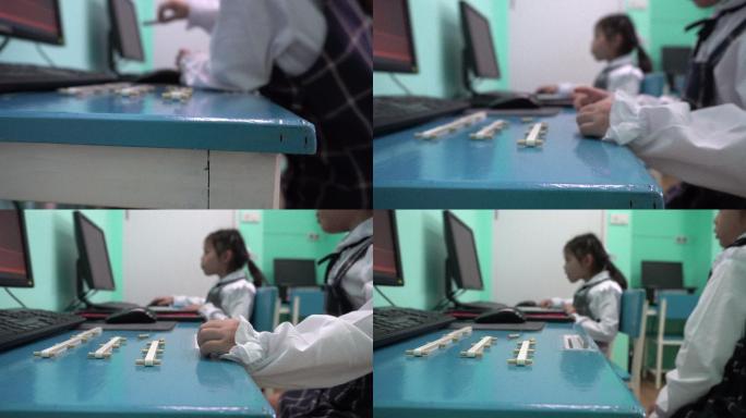 亚洲孩子学习使用电脑