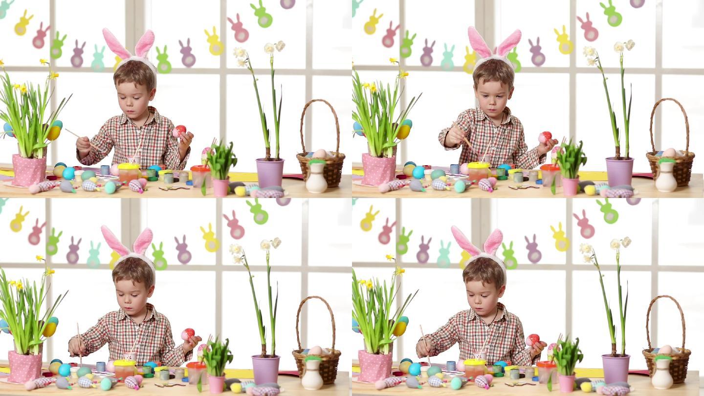 快乐的孩子戴着兔子耳朵在复活节画彩蛋