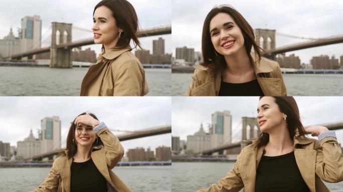 在布鲁克林大桥附近快乐地笑着的漂亮女人。