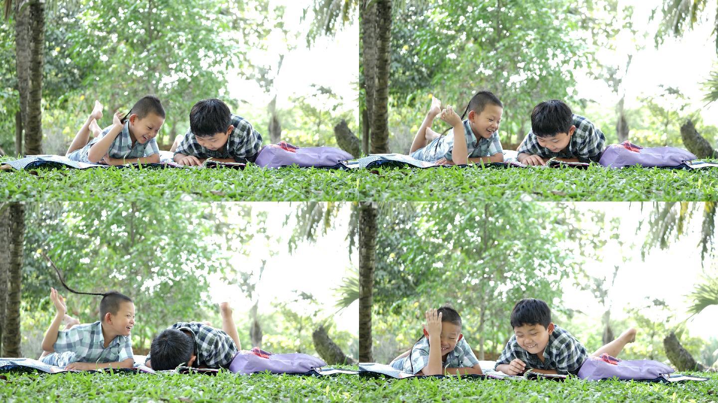 两个男孩正在公园里看书