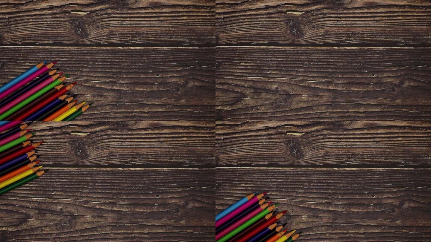 木制背景上的彩色铅笔。