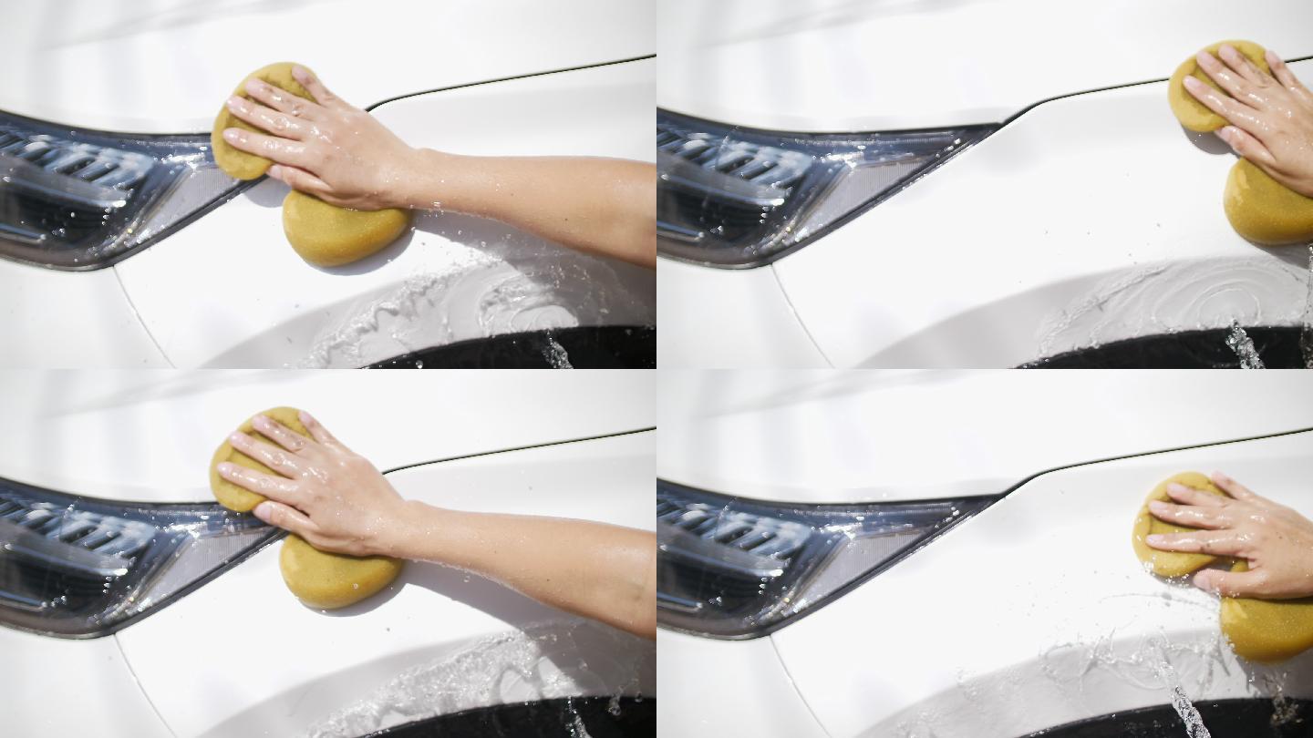 用海绵洗车的女人清洗轿车洗车服务
