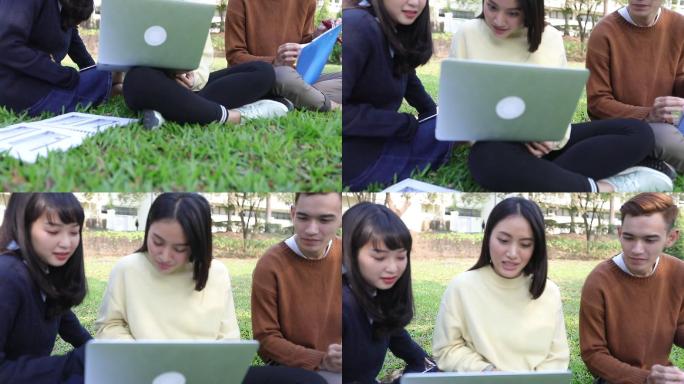 大学生坐在草地上阅读