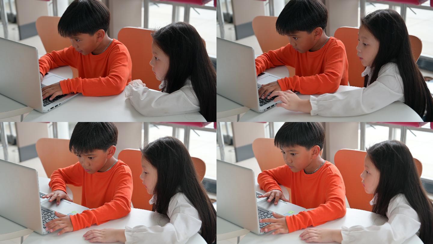 可爱的孩子一起使用笔记本电脑