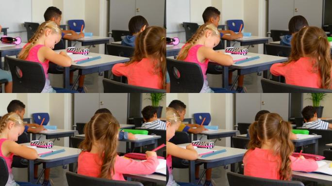 学校的孩子在教室书桌上学习