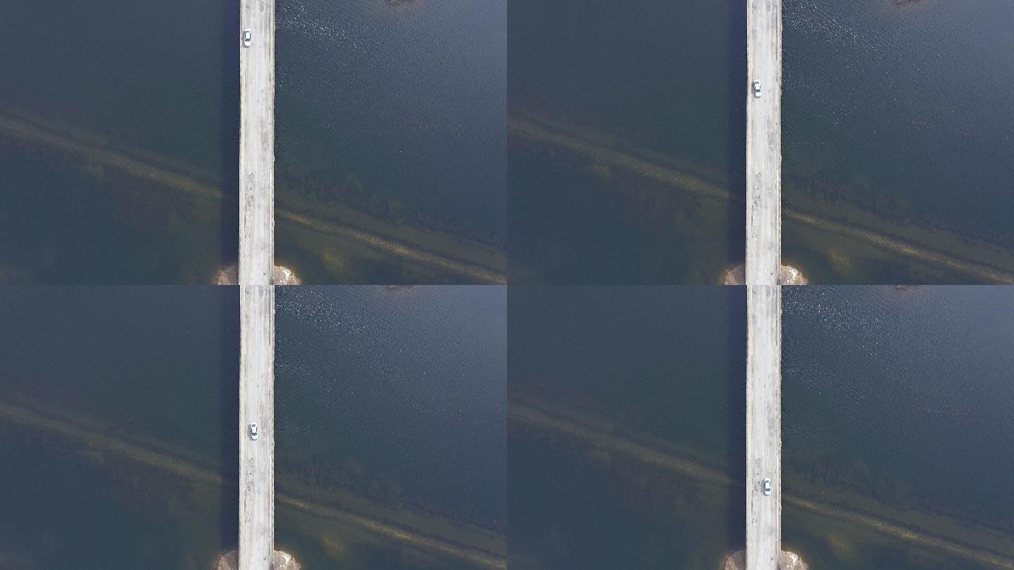 从无人机上鸟瞰一座跨越湖泊的桥