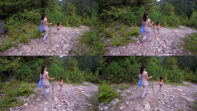 母亲和女儿在森林徒步旅行
