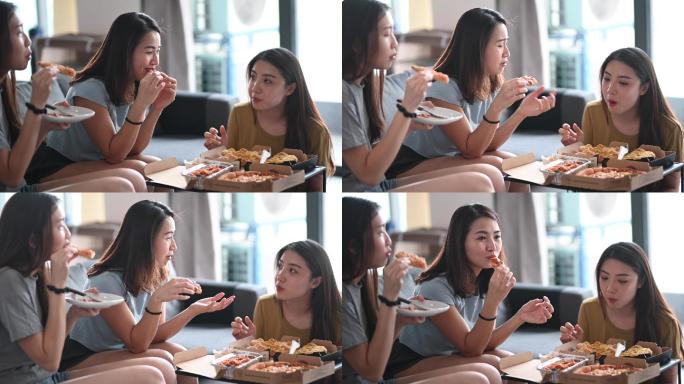 三位女性朋友在客厅吃披萨午餐